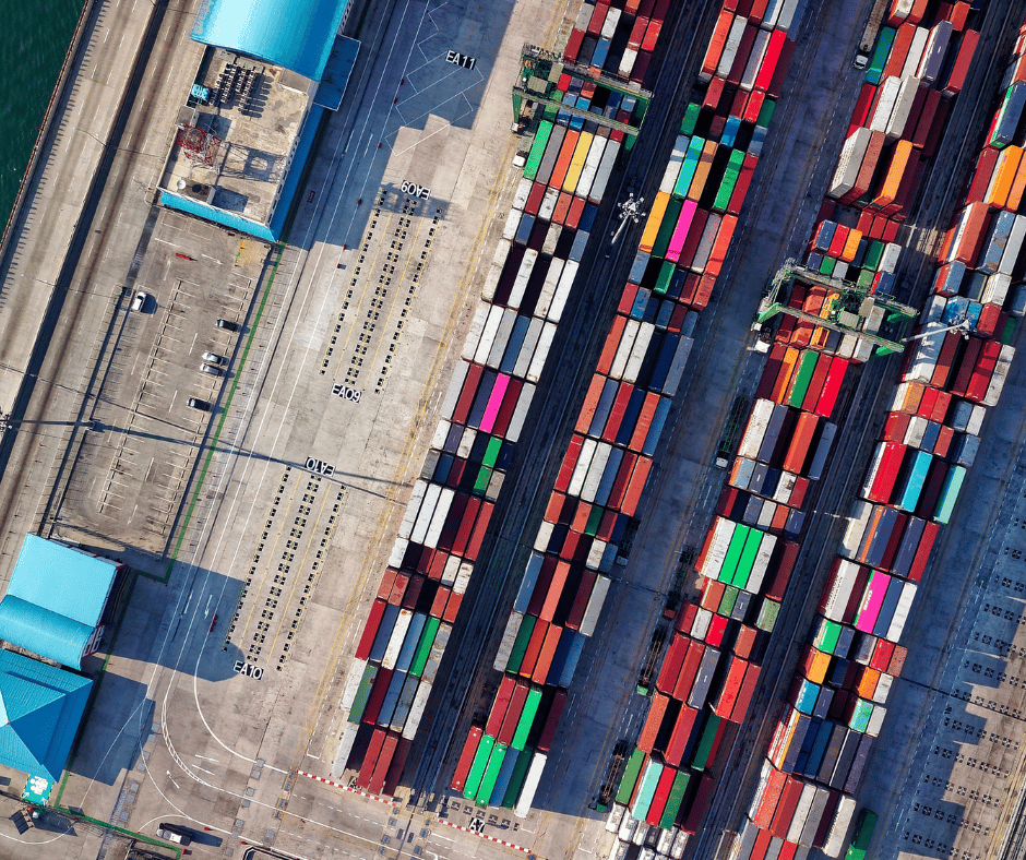 aerial view of shipping containers lined up near a coat. An example of a foreign trade zone.