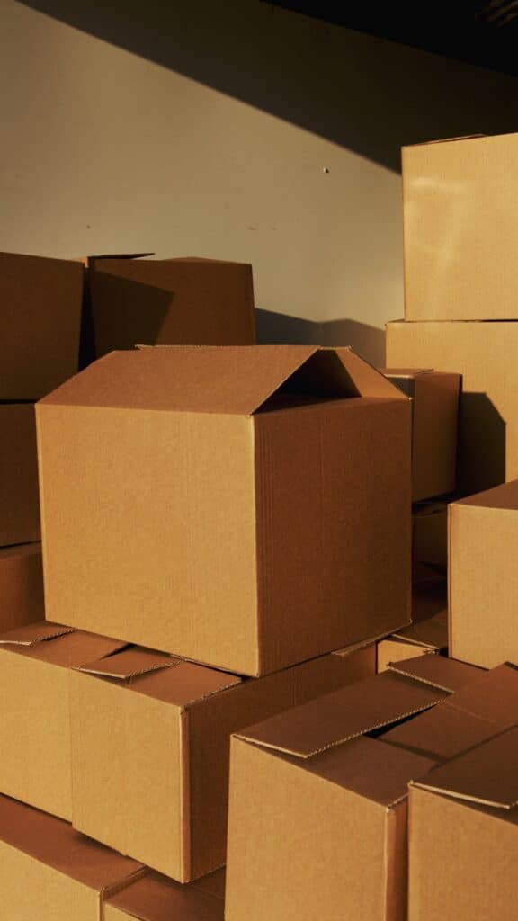 A garage full of boxes with no more space left for storage. Running out of storage space is way reason why you may need to outsource your shipping for your growing business.