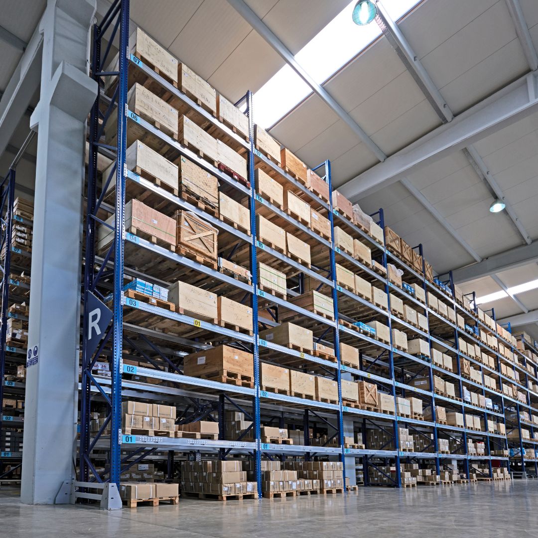 An example of warehouse storage service. It's an image of tall shelves in a warehouse.