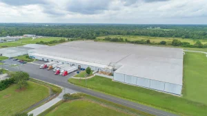 Aerial view of a CWI Warehouse with trucks parked at the loading dock.