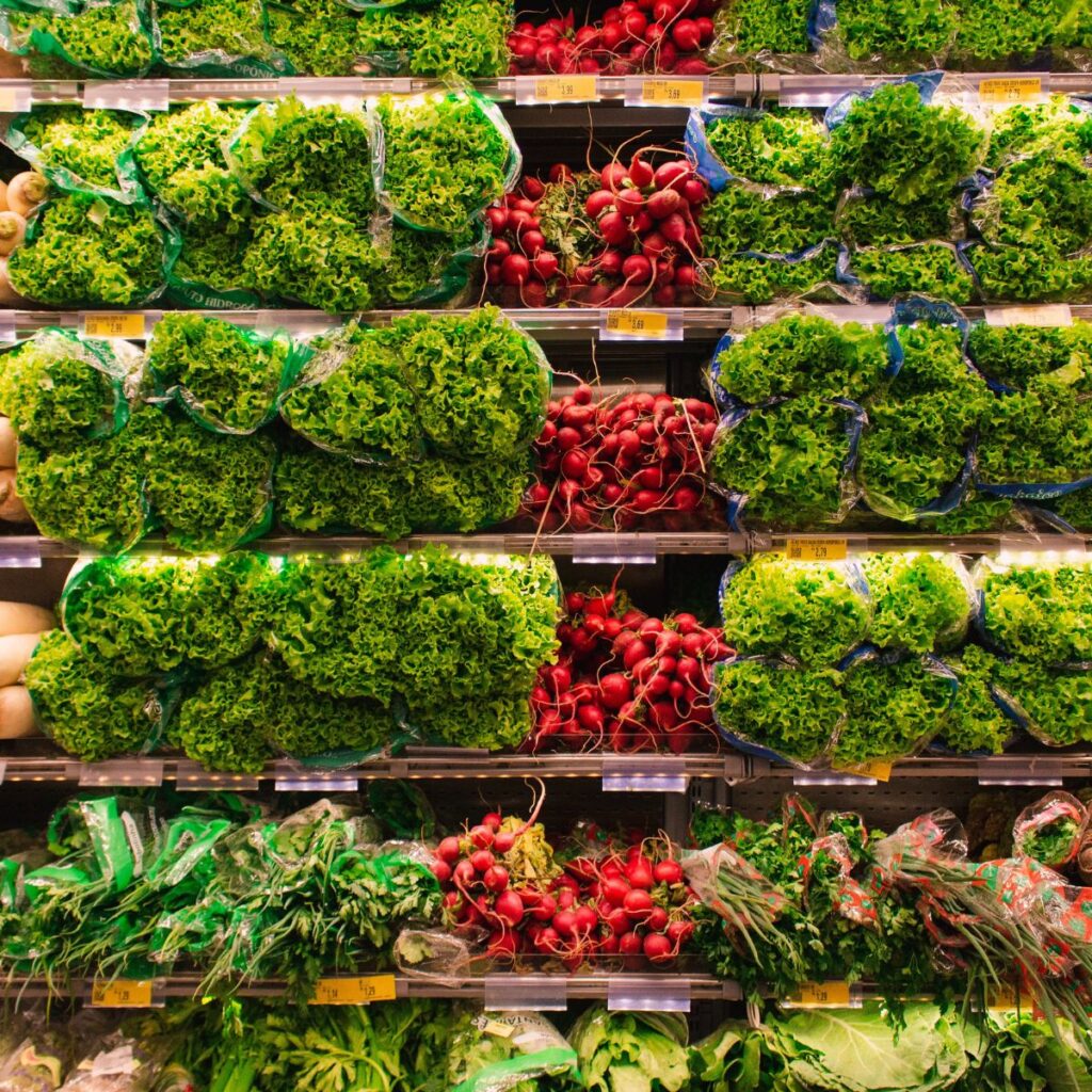 Grocery store - An image of produce stocked on shelves.
